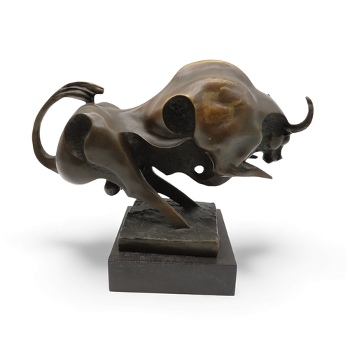 416 - After Miguel Fernando Lopez a contemporary bronze figure of a charging bull, on a black marble base,... 