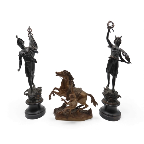 418A - A pair of spelter figures together with a Marli horse