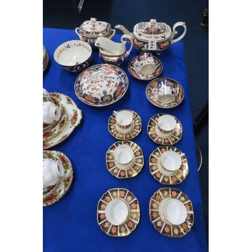 419A - A Derby imari pattern tea set comprising teapot, sucrier, jug, slop bowl, muffin dish and two cups a... 