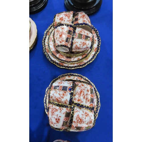 421A - A Royal Crown Derby Chatsworth pattern tea set comprising twelve cups, saucers and plates, two cake ... 