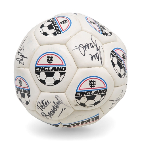 A vintage England football, bearing numerous signatures in marker pen