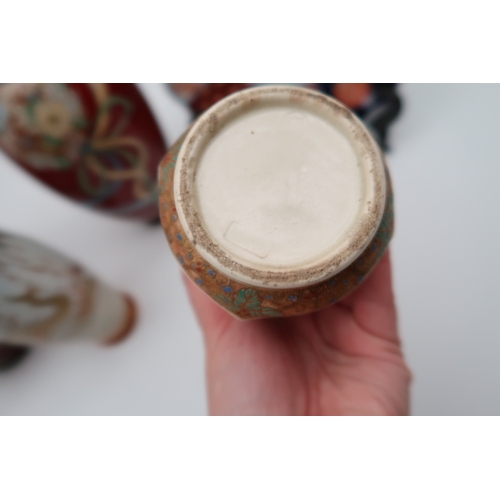 429 - A Japanese vase of lantern form decorated with figures, a dragon decorated cloisonne vase, a flower ... 