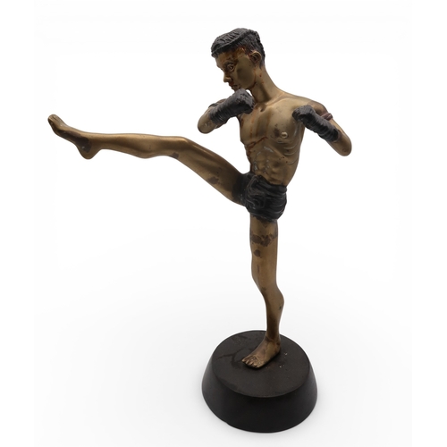 431 - A brass sculpture of a kick boxer