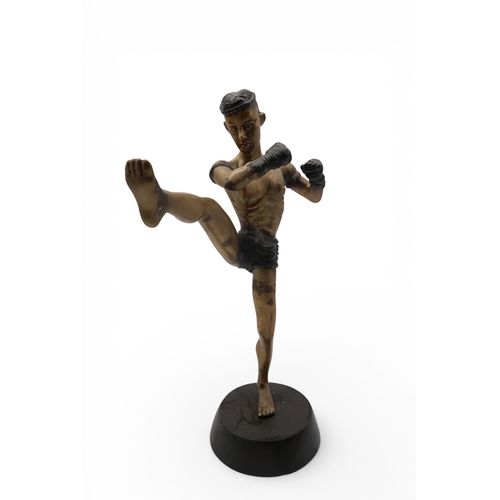 431 - A brass sculpture of a kick boxer
