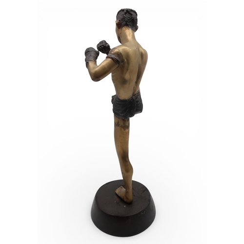 431 - A brass sculpture of a kick boxer
