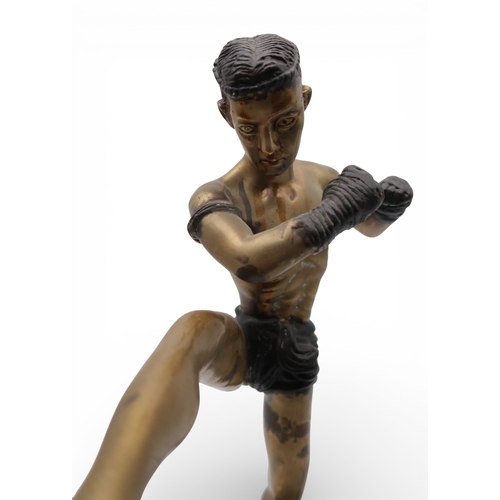 431 - A brass sculpture of a kick boxer