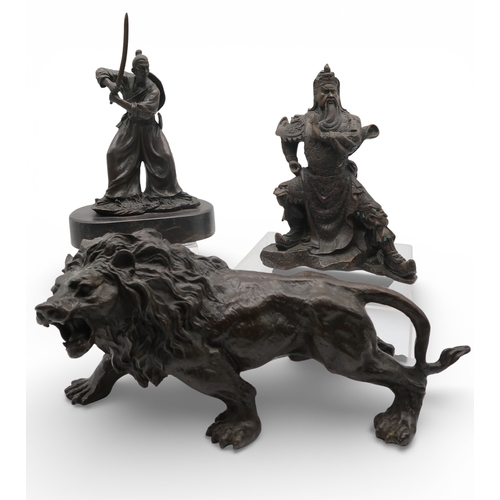 432 - Two bronzed metal sculptures of samurai and a bronze of a lion
