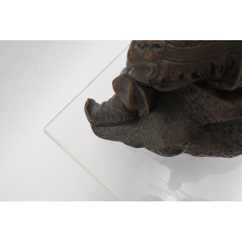 432 - Two bronzed metal sculptures of samurai and a bronze of a lion