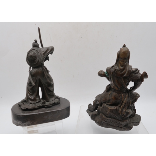 432 - Two bronzed metal sculptures of samurai and a bronze of a lion