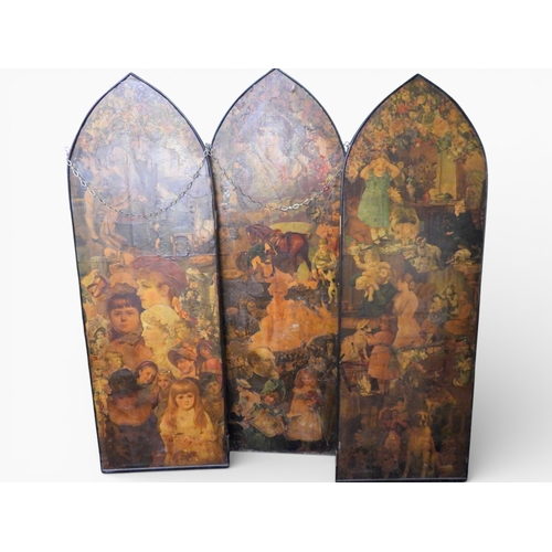 20 - A late 19th century three panel room divider with each arched panel decoupaged with period scraps to... 