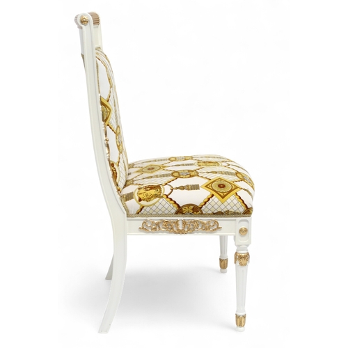 29 - A CONTEMPORARY VERSACE STYLE DINING ROOM SUITE&nbsp;consisting of gilt white dining table on twin fl... 