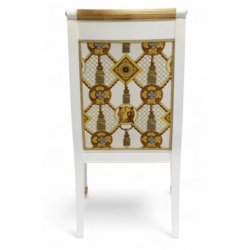 29 - A CONTEMPORARY VERSACE STYLE DINING ROOM SUITE&nbsp;consisting of gilt white dining table on twin fl... 