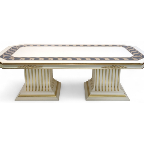 29 - A CONTEMPORARY VERSACE STYLE DINING ROOM SUITE&nbsp;consisting of gilt white dining table on twin fl... 