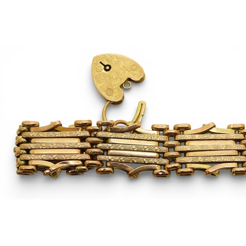 2703 - A 9CT ROSE GOLD GATE BRACELETthe links are stamped 9c, and the clasp 9ct gold with the makers mark W... 