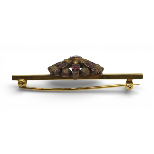 2706 - THREE VINTAGE BROOCHESa yellow metal bar brooch set with a blue glass gem, faintly stamped with a ha... 