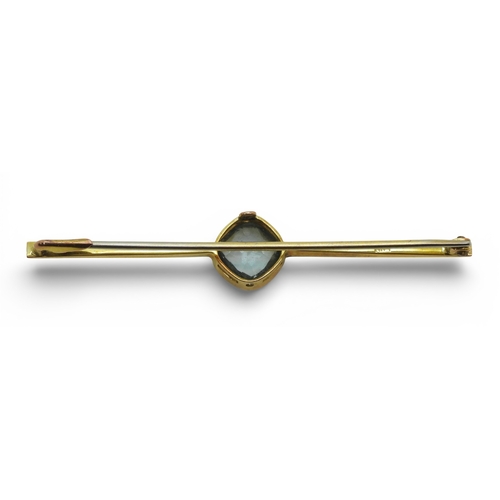 2706 - THREE VINTAGE BROOCHESa yellow metal bar brooch set with a blue glass gem, faintly stamped with a ha... 