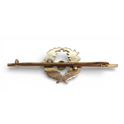 2712 - THREE BROOCHESa 9ct gold bar brooch set with a pearl surrounded with a wreath of thistles, length 5c... 
