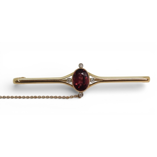 2715 - A GARNET & DIAMOND BROOCHmounted in 15ct gold set with a 10mm x 7.5mm facet cut garnet and four ... 