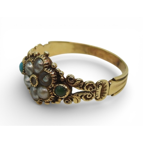2716 - A GEORGIAN STYLE RINGmounted in yellow metal the shoulders with shell and flower details, set with a... 