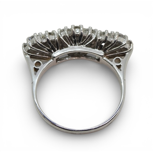 2717 - A RING OF THREE FLOWERSset in 18ct white gold and set with estimated approx 1.60cts of brilliant cut... 