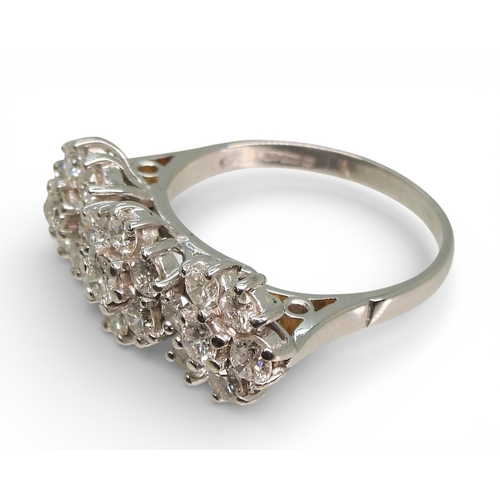 2717 - A RING OF THREE FLOWERSset in 18ct white gold and set with estimated approx 1.60cts of brilliant cut... 