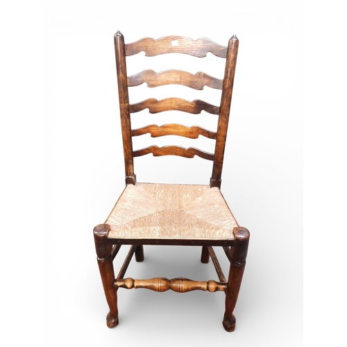 15 - A lot comprising a set of four 18th century style ash and elm ladderback rush seated dining chairs, ... 
