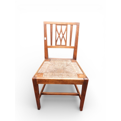 15 - A lot comprising a set of four 18th century style ash and elm ladderback rush seated dining chairs, ... 