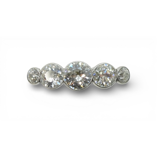 2722 - A FIVE STONE DIAMOND RINGset with five old cut diamonds, in a delicate bright white metal  mill-grai... 