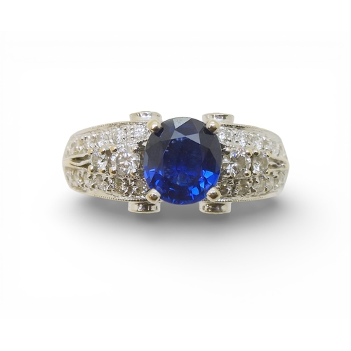 2723 - A SAPPHIRE AND DIAMOND RINGmounted in 18k white gold, set with an oval cut blue sapphire of approx 7... 