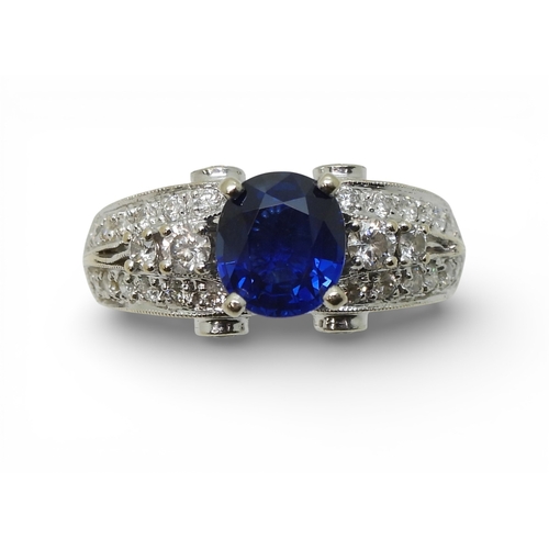 2723 - A SAPPHIRE AND DIAMOND RINGmounted in 18k white gold, set with an oval cut blue sapphire of approx 7... 