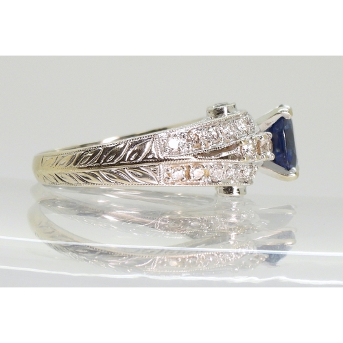 2723 - A SAPPHIRE AND DIAMOND RINGmounted in 18k white gold, set with an oval cut blue sapphire of approx 7... 