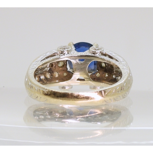 2723 - A SAPPHIRE AND DIAMOND RINGmounted in 18k white gold, set with an oval cut blue sapphire of approx 7... 