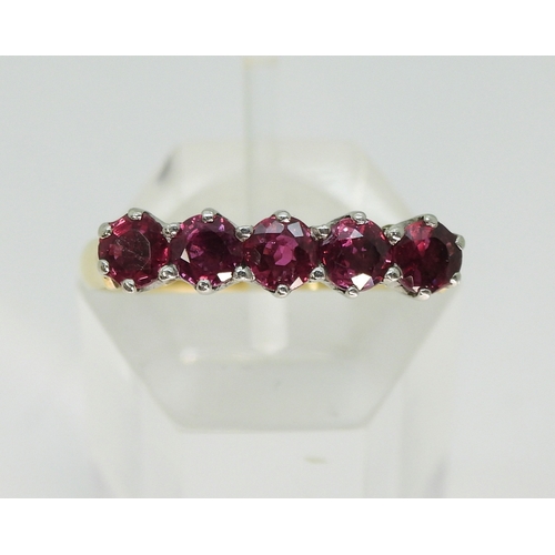 2726 - A RUBY ETERNITY RINGwith a yellow and white 18ct gold mount, set with five rubies each approx 3.5mm.... 