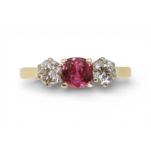 2727 - A RUBY AND DIAMOND RINGin 18ct yellow and white gold, set with a cushion cut ruby of approx 5.4mm x ... 