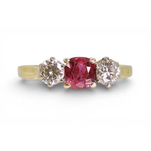 2727 - A RUBY AND DIAMOND RINGin 18ct yellow and white gold, set with a cushion cut ruby of approx 5.4mm x ... 