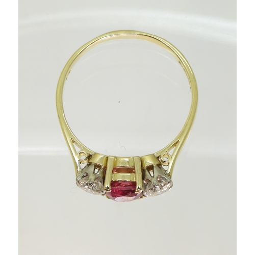 2727 - A RUBY AND DIAMOND RINGin 18ct yellow and white gold, set with a cushion cut ruby of approx 5.4mm x ... 