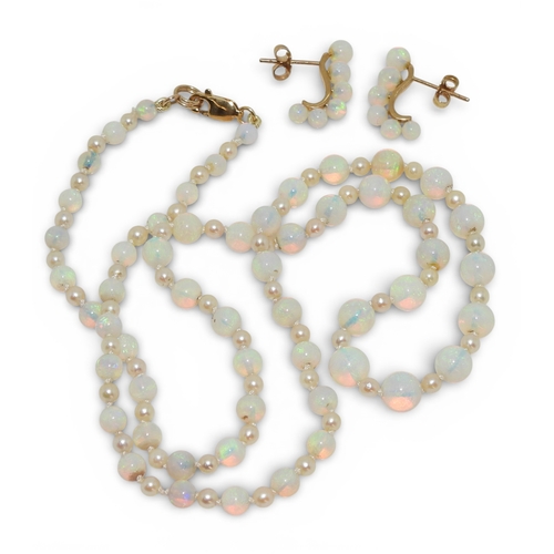 2729 - A SUITE OF OPAL JEWELSto include a pair of creole earrings each with six graduated opal beads on a 1... 