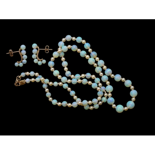 2729 - A SUITE OF OPAL JEWELSto include a pair of creole earrings each with six graduated opal beads on a 1... 