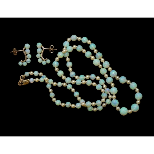2729 - A SUITE OF OPAL JEWELSto include a pair of creole earrings each with six graduated opal beads on a 1... 