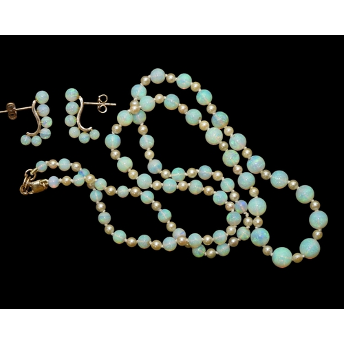2729 - A SUITE OF OPAL JEWELSto include a pair of creole earrings each with six graduated opal beads on a 1... 