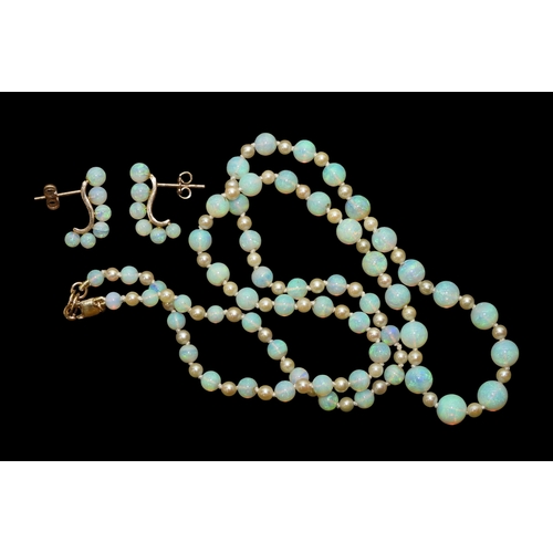 2729 - A SUITE OF OPAL JEWELSto include a pair of creole earrings each with six graduated opal beads on a 1... 
