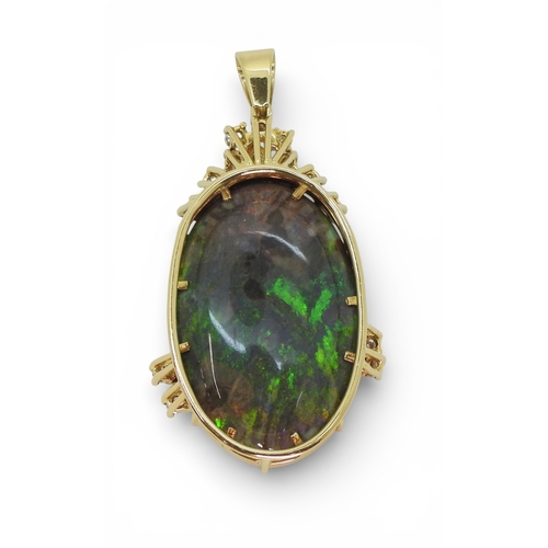 2731 - AN OPAL & DIAMOND PENDANTmounted in 18ct gold, the substantial opal of approx 30mm x 18mm x 6.8m... 