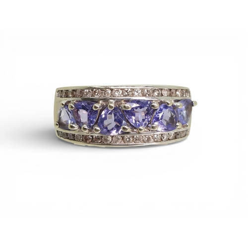 2735 - A SUITE OF TANZANITE & DIAMOND JEWELSa 14k white gold pear shaped tanzanite and diamond bracelet... 