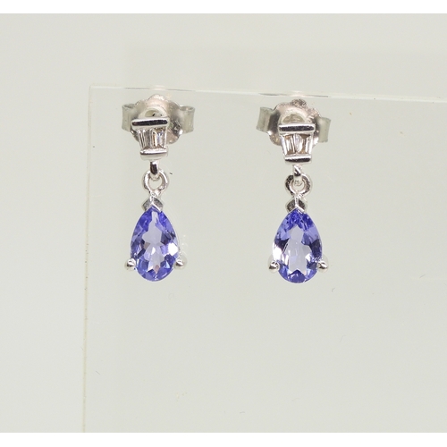 2735 - A SUITE OF TANZANITE & DIAMOND JEWELSa 14k white gold pear shaped tanzanite and diamond bracelet... 