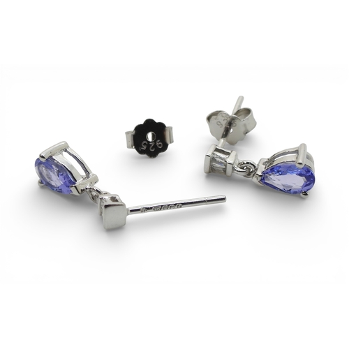 2735 - A SUITE OF TANZANITE & DIAMOND JEWELSa 14k white gold pear shaped tanzanite and diamond bracelet... 