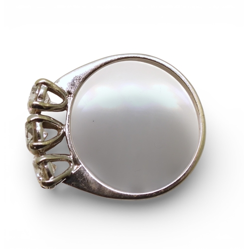 2736 - A THREE STONE DIAMOND RINGthe mount in 9ct white gold and set with three brilliant cut diamonds with... 