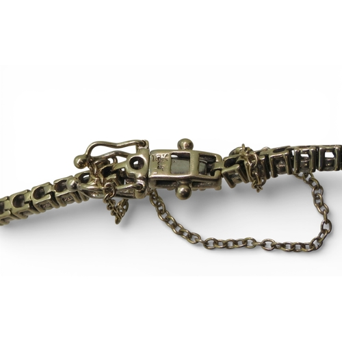 2737 - A DIAMOND LINE BRACELETthe mount in 18k white gold and set with estimated approx 2.28cts of brillian... 