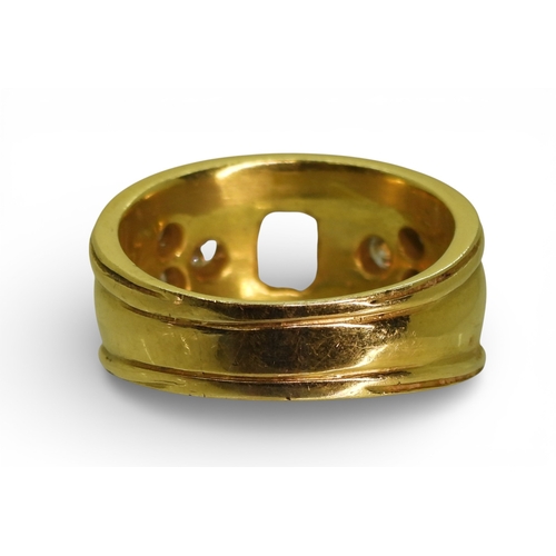 2738 - A DIAMOND SET WIDE BAND RINGthe 18ct gold mount is set with an oblong princess cut diamond of estima... 