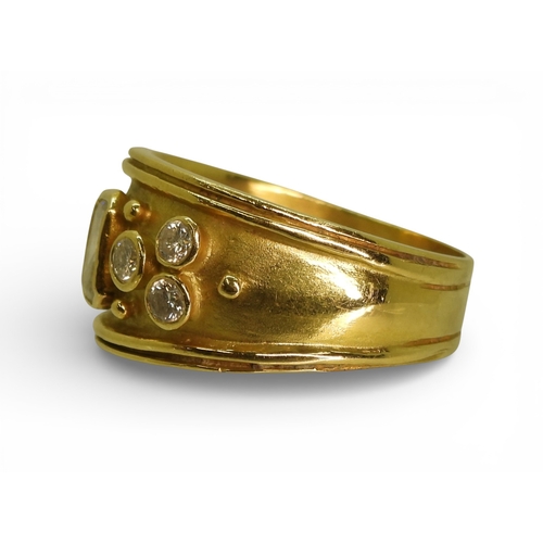 2738 - A DIAMOND SET WIDE BAND RINGthe 18ct gold mount is set with an oblong princess cut diamond of estima... 