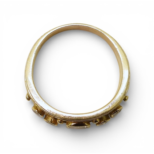 2738 - A DIAMOND SET WIDE BAND RINGthe 18ct gold mount is set with an oblong princess cut diamond of estima... 
